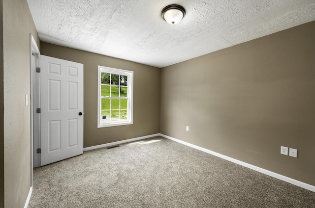 2800 State Highway Bb, Hollister, MO 65672 - empty room with carpet, baseboards, and a textured ceiling