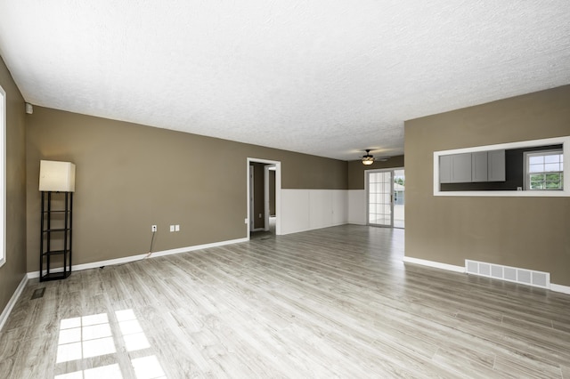 2800 State Highway Bb, Hollister, MO 65672 - unfurnished room with ceiling fan, wood finished floors, a textured ceiling, and baseboards