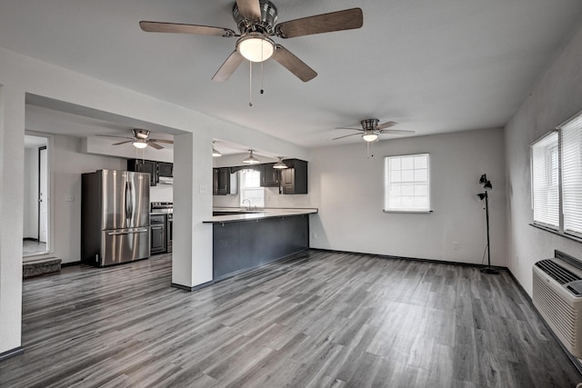 511 N E, Columbus, KS 66725 - kitchen featuring stainless steel appliances, wood finished floors, and ceiling fan