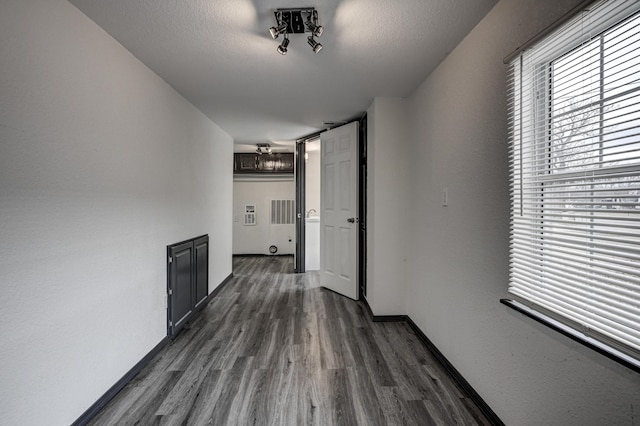 511 N E, Columbus, KS 66725 - hallway with dark wood-type flooring and baseboards