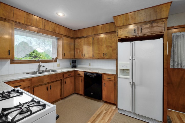 940 Carl Allen St, Mount Vernon, MO 65712 - kitchen with white appliances, a sink, brown cabinets, and recessed lighting