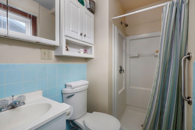 940 Carl Allen St, Mount Vernon, MO 65712 - bathroom with a stall shower, toilet, tile walls, vanity, and wainscoting