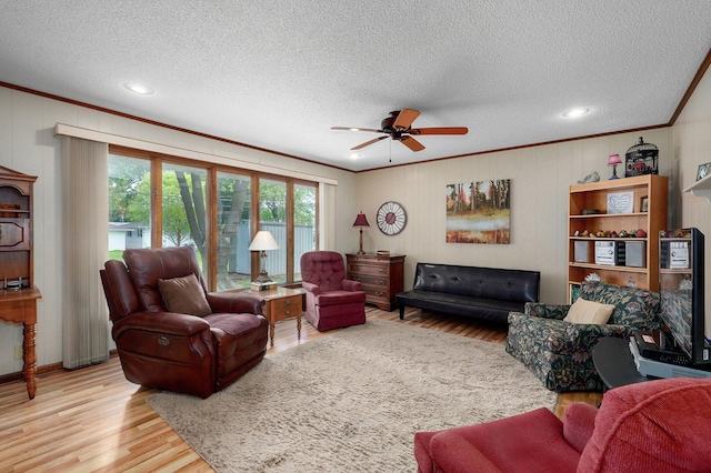 940 Carl Allen St, Mount Vernon, MO 65712 - living area with crown molding, wood finished floors, a ceiling fan, a textured ceiling, and recessed lighting
