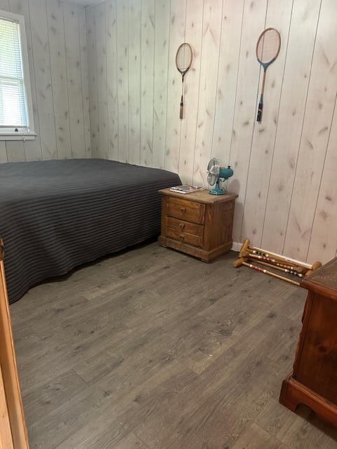 TBD Kings Cove Ln Unit 16, Reeds Spring, MO 65737 - bedroom featuring wood finished floors and wooden walls