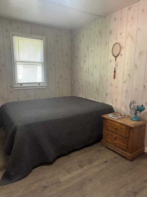 TBD Kings Cove Ln Unit 16, Reeds Spring, MO 65737 - bedroom with wood finished floors and wooden walls