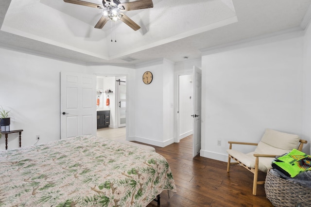 604 N Cascades Dr, Nixa, MO 65714 - bedroom with a tray ceiling, hardwood / wood-style flooring, and baseboards