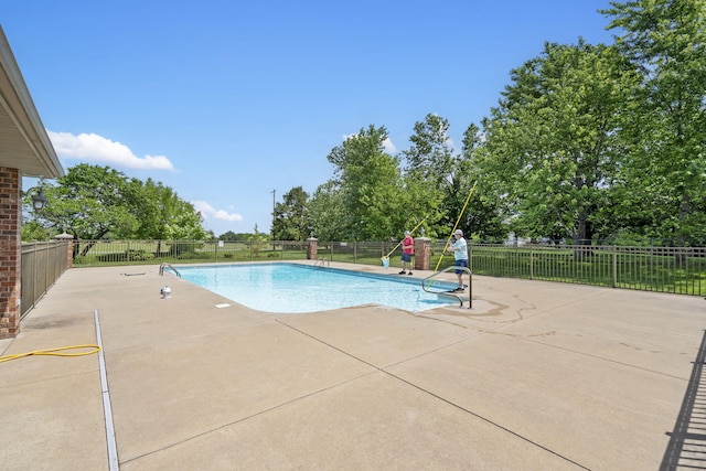 604 N Cascades Dr, Nixa, MO 65714 - view of swimming pool with a patio and view of scattered trees