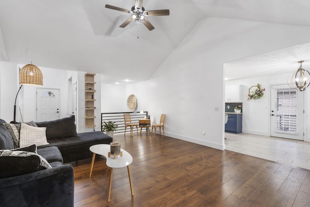 604 N Cascades Dr, Nixa, MO 65714 - living area featuring ceiling fan, wood finished floors, high vaulted ceiling, a chandelier, and baseboards