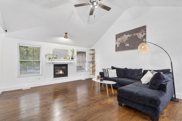 604 N Cascades Dr, Nixa, MO 65714 - living area with ceiling fan, a glass covered fireplace, wood-type flooring, high vaulted ceiling, and baseboards