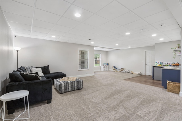604 N Cascades Dr, Nixa, MO 65714 - carpeted living area featuring a paneled ceiling, recessed lighting, and baseboards