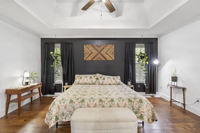 604 N Cascades Dr, Nixa, MO 65714 - bedroom with a tray ceiling, dark wood-style floors, and baseboards
