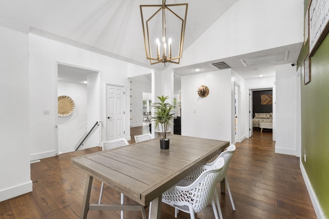 604 N Cascades Dr, Nixa, MO 65714 - dining area with hardwood / wood-style floors, baseboards, high vaulted ceiling, and a chandelier