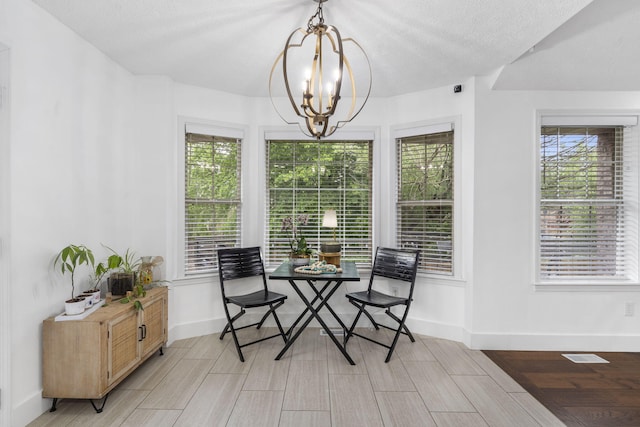 604 N Cascades Dr, Nixa, MO 65714 - dining space featuring a chandelier, healthy amount of natural light, and baseboards