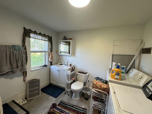 9611 Co Rd Unit A-436, Ava, MO 65608 - bathroom with separate washer and dryer, toilet, vanity, baseboards, and heating unit