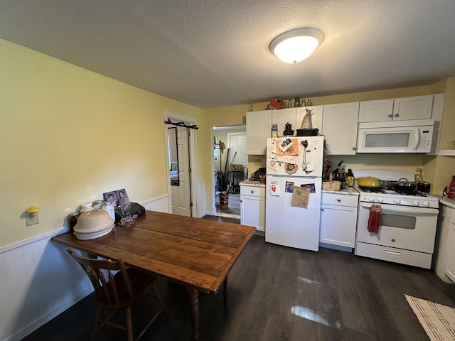 9611 Co Rd Unit A-436, Ava, MO 65608 - kitchen with white appliances, dark wood-style flooring, a textured ceiling, white cabinetry, and light countertops