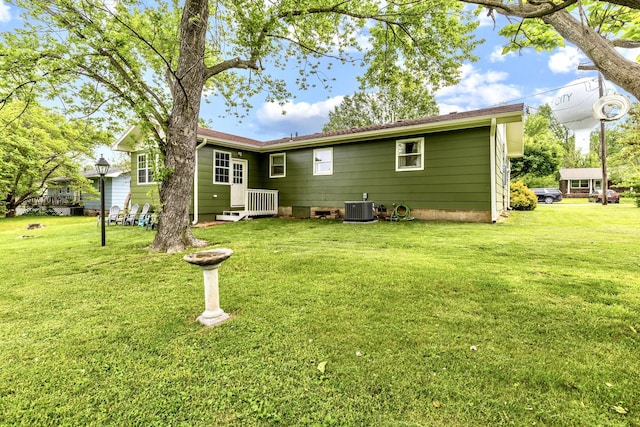 801 N Myrtle St, Pierce City, MO 65723 - rear view of property with central air condition unit and a yard