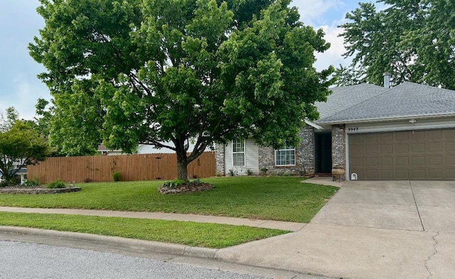 3943 W Kay Pointe Blvd, Springfield, MO 65802 - view of front facade with concrete driveway, a garage, stone siding, and roof with shingles