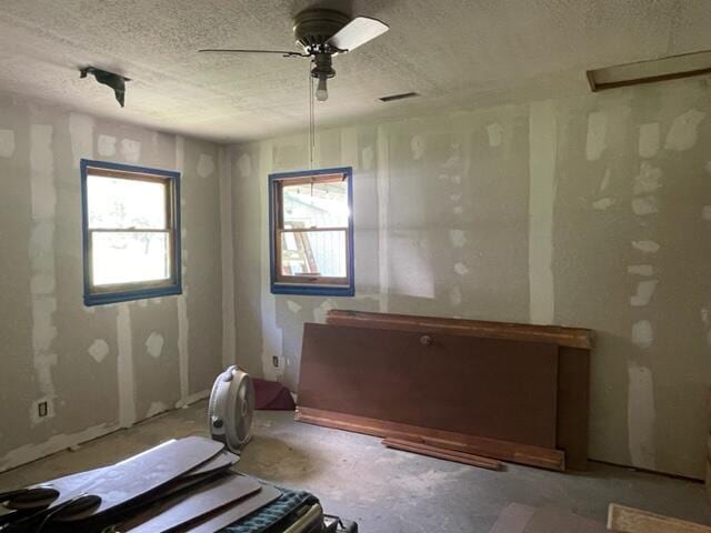 10694 Red Spring Rd, Mountain Grove, MO 65711 - interior space with a textured ceiling and ceiling fan