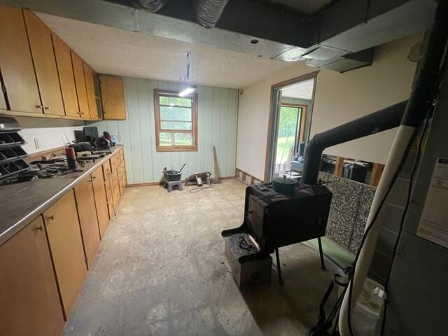 10694 Red Spring Rd, Mountain Grove, MO 65711 - kitchen featuring baseboards and brown cabinets