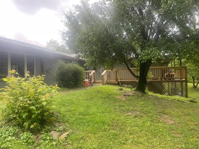 10694 Red Spring Rd, Mountain Grove, MO 65711 - view of grassy yard featuring a wooden deck