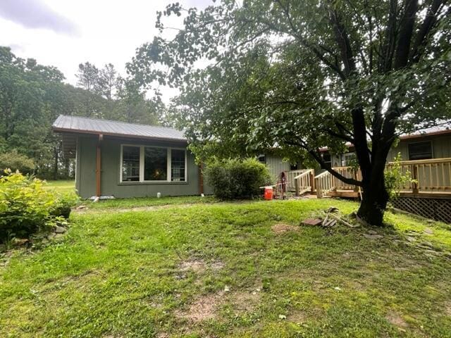 10694 Red Spring Rd, Mountain Grove, MO 65711 - view of grassy yard with a deck