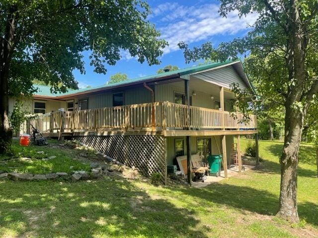 10694 Red Spring Rd, Mountain Grove, MO 65711 - rear view of house with a lawn and a wooden deck
