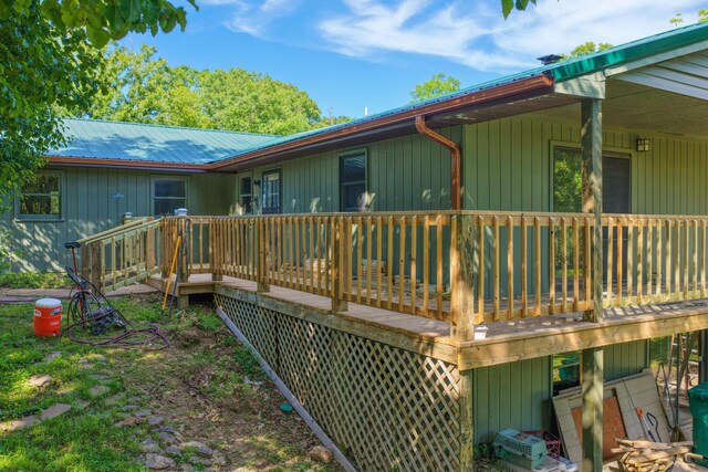 10694 Red Spring Rd, Mountain Grove, MO 65711 - rear view of property featuring a deck and metal roof