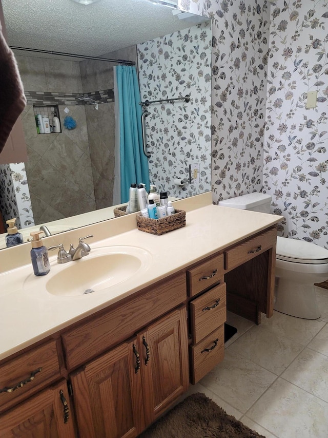 150 Sunken Forest Dr Unit 235, Forsyth, MO 65653 - full bathroom featuring wallpapered walls, toilet, vanity, tiled shower, and a textured ceiling