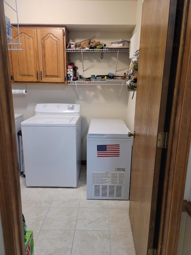150 Sunken Forest Dr Unit 235, Forsyth, MO 65653 - laundry area featuring washing machine and dryer and cabinet space