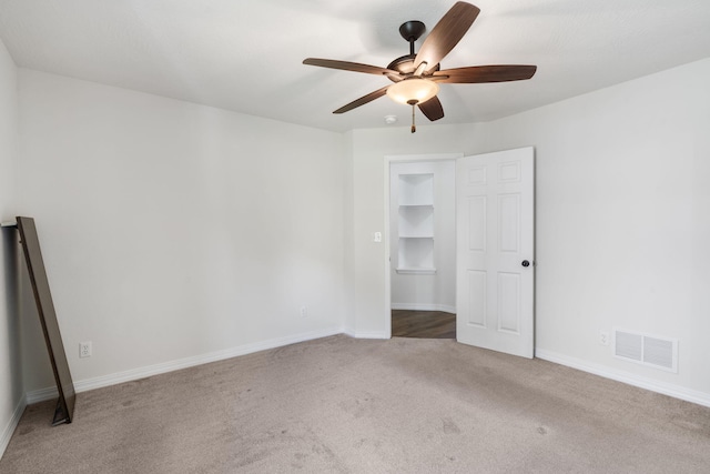 131 Lake Beach Ln, Hollister, MO 65672 - unfurnished bedroom featuring carpet flooring, baseboards, and a ceiling fan