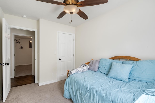 131 Lake Beach Ln, Hollister, MO 65672 - bedroom featuring light carpet, baseboards, and ceiling fan
