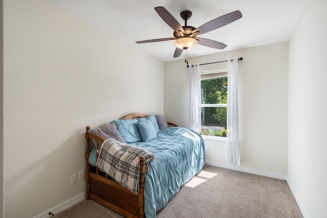 131 Lake Beach Ln, Hollister, MO 65672 - bedroom with light colored carpet, baseboards, and a ceiling fan