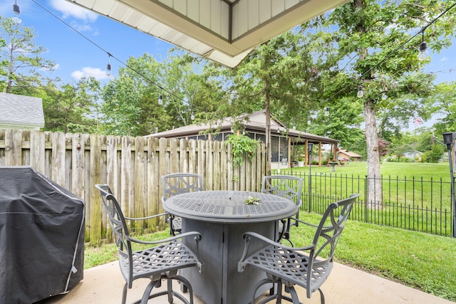 131 Lake Beach Ln, Hollister, MO 65672 - view of patio with outdoor dining area and a grill