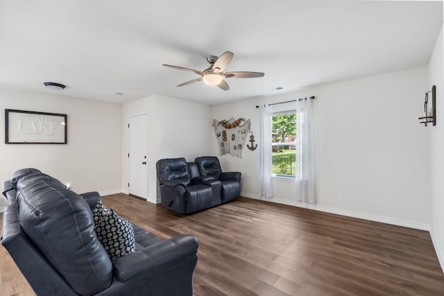 131 Lake Beach Ln, Hollister, MO 65672 - living room featuring a ceiling fan, dark wood finished floors, and baseboards