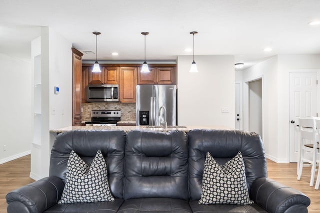 131 Lake Beach Ln, Hollister, MO 65672 - living room featuring light wood finished floors, baseboards, and recessed lighting