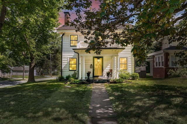1501 E Walnut St, Springfield, MO 65802 - view of front facade featuring a yard, a chimney, and covered porch