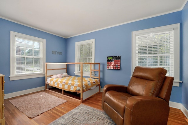 1501 E Walnut St, Springfield, MO 65802 - bedroom with crown molding, wood finished floors, and baseboards