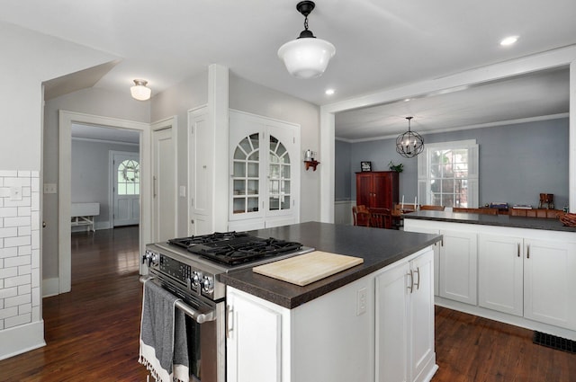 1501 E Walnut St, Springfield, MO 65802 - kitchen featuring stainless steel gas range oven, dark countertops, dark wood-style flooring, plenty of natural light, and recessed lighting