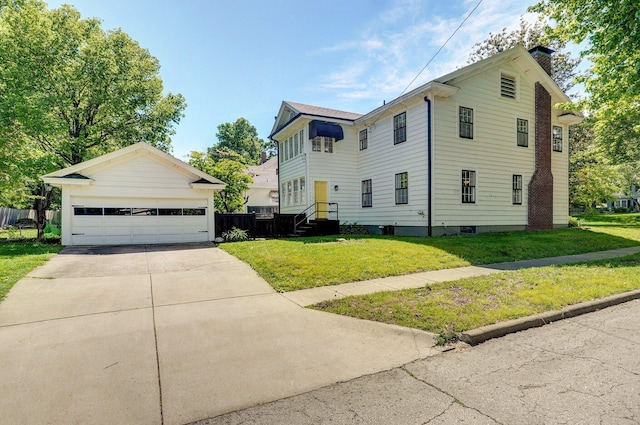 1501 E Walnut St, Springfield, MO 65802 - view of front of home with a chimney, a front yard, and a detached garage