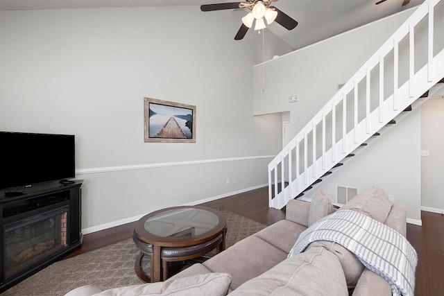 10 Treehouse Ln Unit 11, Branson, MO 65616 - living room featuring stairs, baseboards, wood finished floors, ceiling fan, and high vaulted ceiling