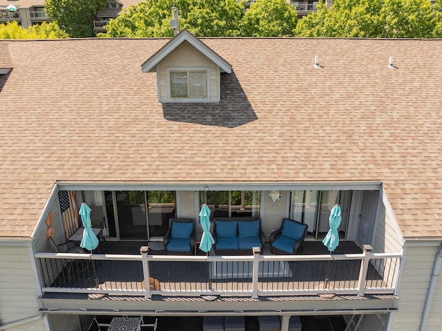 10 Treehouse Ln Unit 11, Branson, MO 65616 - rear view of house with roof with shingles and an outdoor hangout area