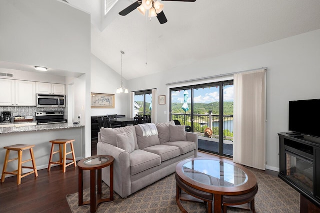10 Treehouse Ln Unit 11, Branson, MO 65616 - living room featuring a ceiling fan, dark wood-style floors, and high vaulted ceiling