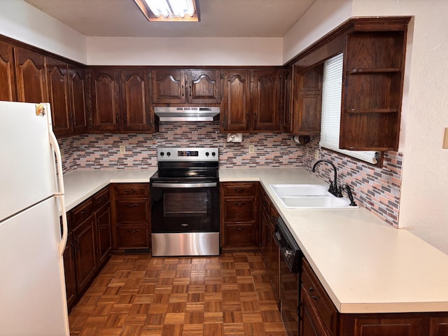 kitchen with stainless steel electric range oven, a sink, freestanding refrigerator, under cabinet range hood, and black dishwasher