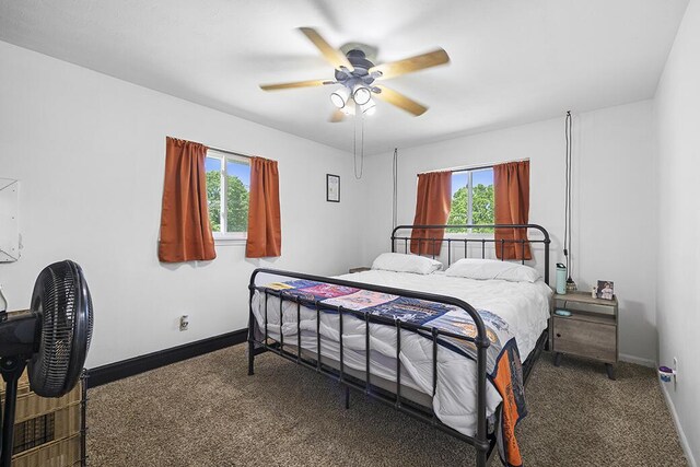 103 W Mockingbird Ln, Crane, MO 65633 - carpeted bedroom featuring baseboards and ceiling fan