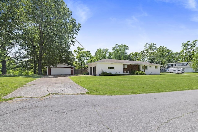 103 W Mockingbird Ln, Crane, MO 65633 - ranch-style house featuring a detached garage, an outdoor structure, and a front lawn