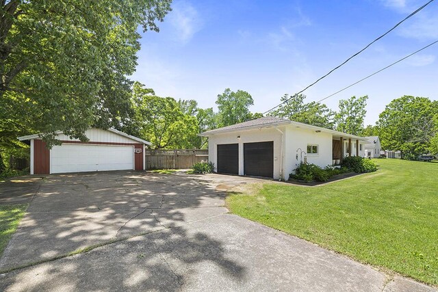 103 W Mockingbird Ln, Crane, MO 65633 - view of front of property featuring a garage and an outdoor structure