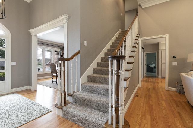 2539 S Forrest Heights Ave, Springfield, MO 65809 - entrance foyer featuring light wood-type flooring, a high ceiling, stairs, and baseboards