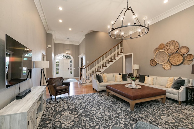 2539 S Forrest Heights Ave, Springfield, MO 65809 - living room featuring a chandelier, stairway, recessed lighting, a high ceiling, and wood finished floors