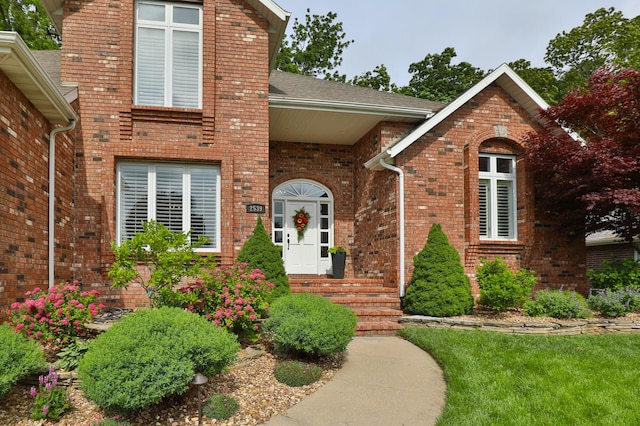 2539 S Forrest Heights Ave, Springfield, MO 65809 - doorway to property with brick siding and roof with shingles