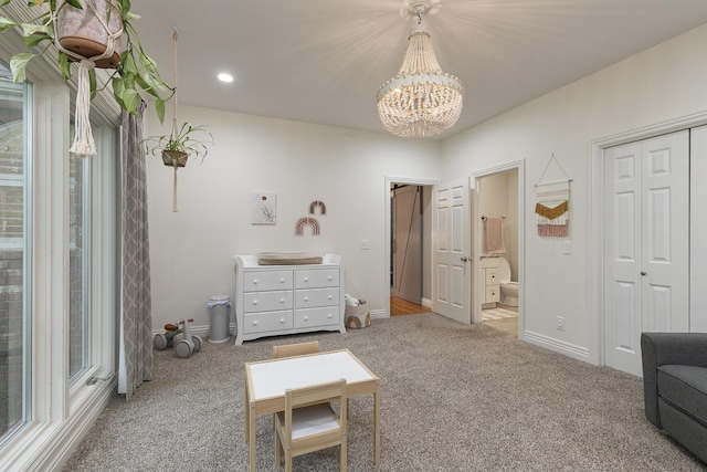 2539 S Forrest Heights Ave, Springfield, MO 65809 - carpeted bedroom with a chandelier, ensuite bath, recessed lighting, baseboards, and a sink